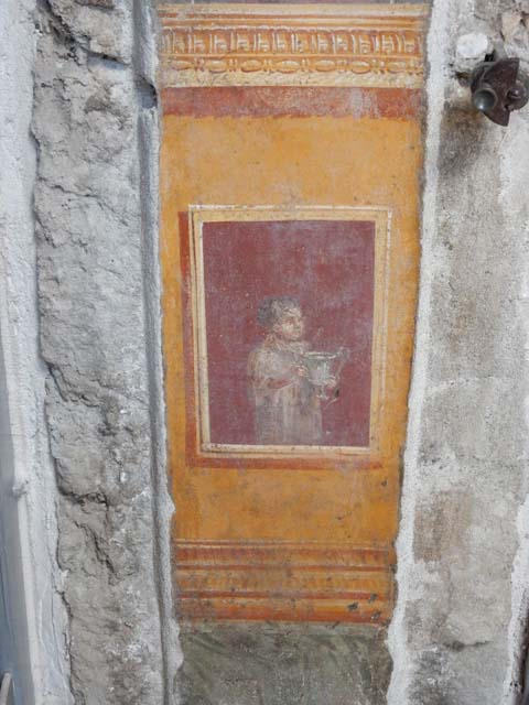VI.15.1 Pompeii. May 2017. Detail of painted panel on west wall of atrium, leading onto peristyle. Photo courtesy of Buzz Ferebee.
