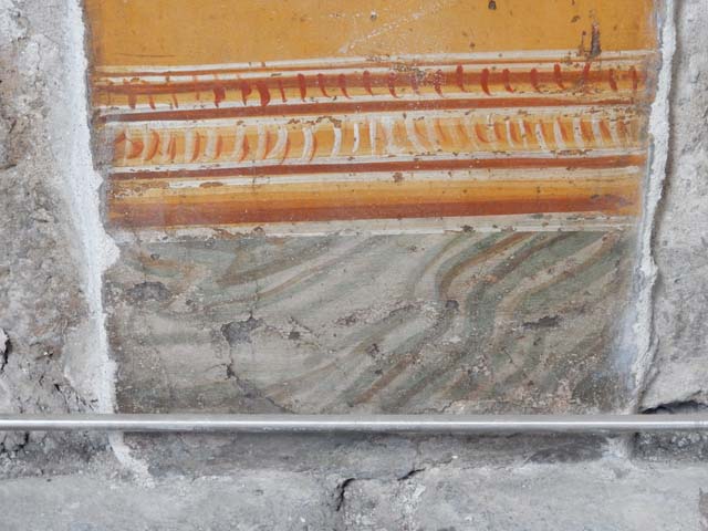 VI.15.1 Pompeii. June 2019.  
Detail of painting in atrium between doorways to bedroom on left of main entrance and oecus on south side. 
Photo courtesy of Buzz Ferebee.
