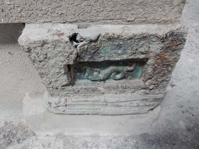 VI.15.1 Pompeii. May 2017. 
North side of atrium, decoration from remains of strong box at east end. Photo courtesy of Buzz Ferebee.

