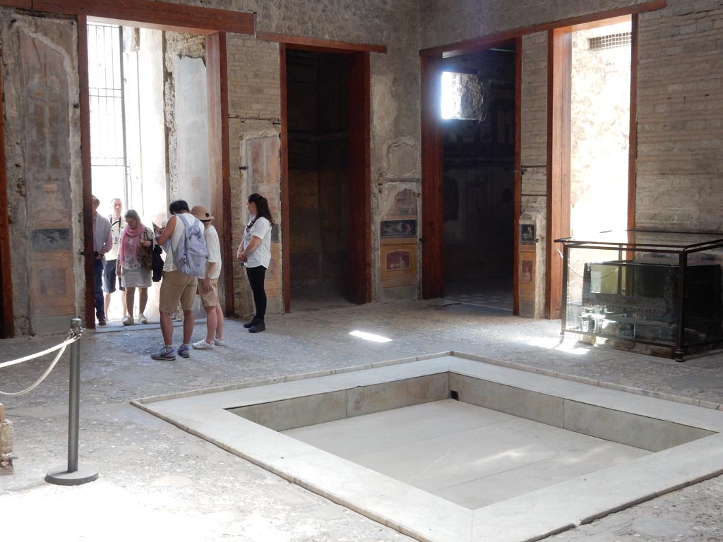 VI.15.1 Pompeii. May 2017. 
Looking south-east across atrium, with doorway to bedroom on left of main entrance, in centre of photo. Photo courtesy of Buzz Ferebee.
