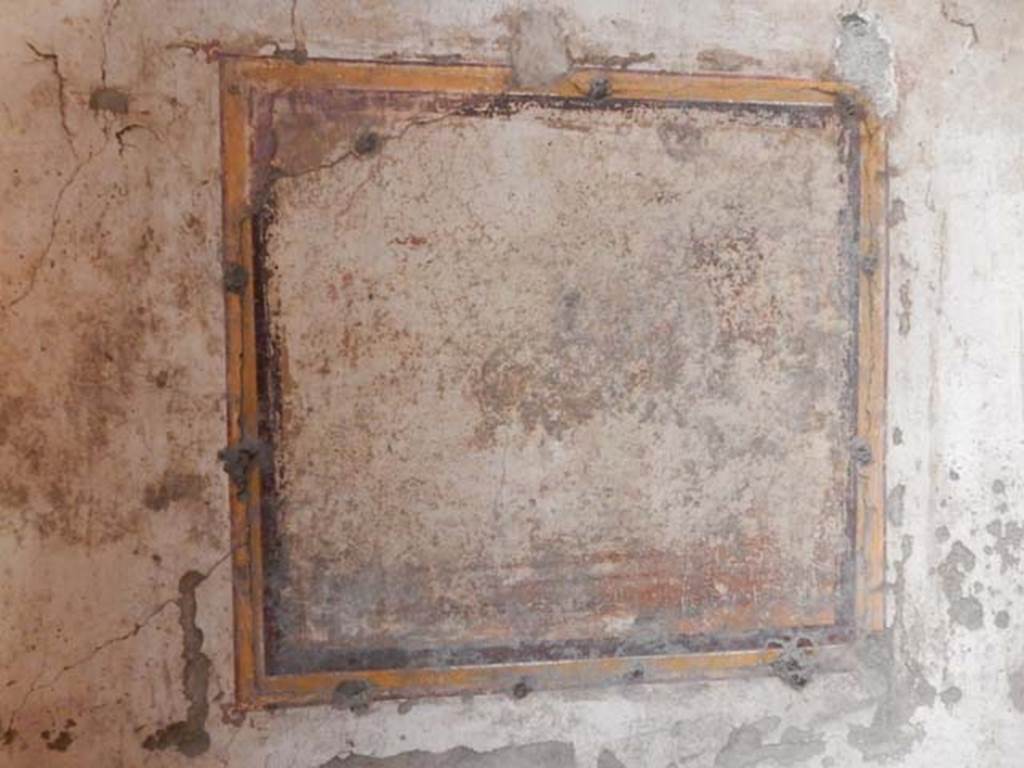 VI.15.1 Pompeii. May 2017. Detail of remains of illegible painting in centre of east wall.  Photo courtesy of Buzz Ferebee.
