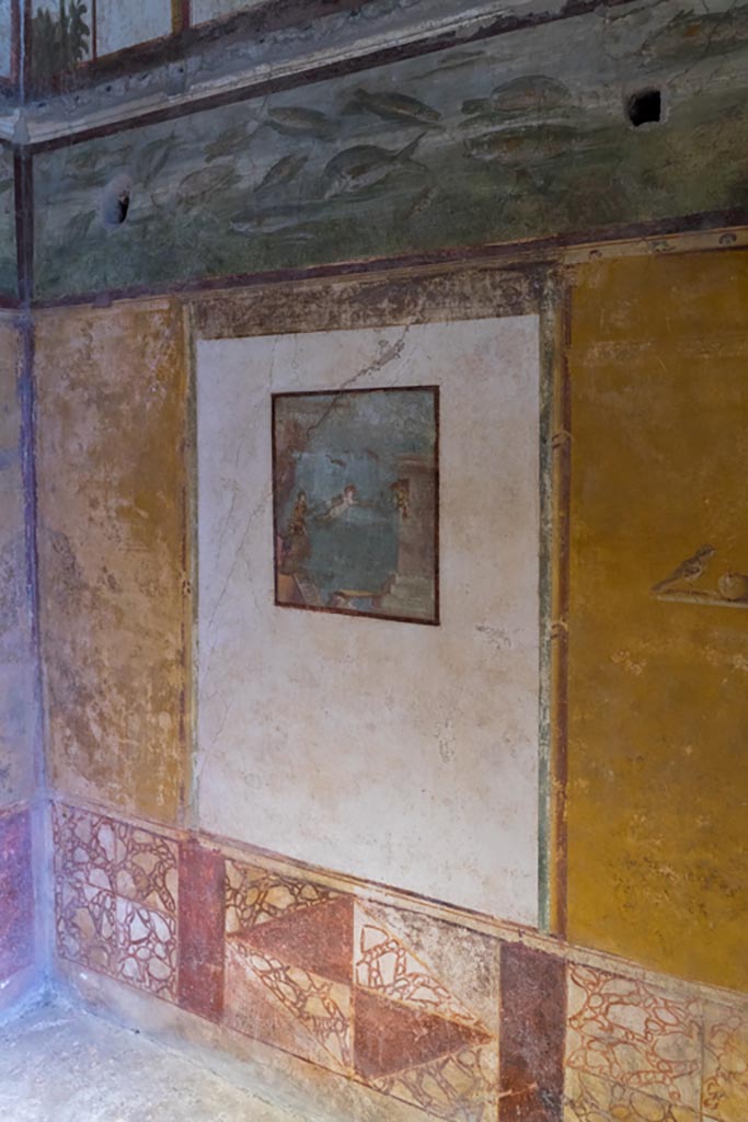 VI.15.1 Pompeii. March 2023. 
Looking east along south wall with central painting of Leander and Hero.
Photo courtesy of Johannes Eber.

