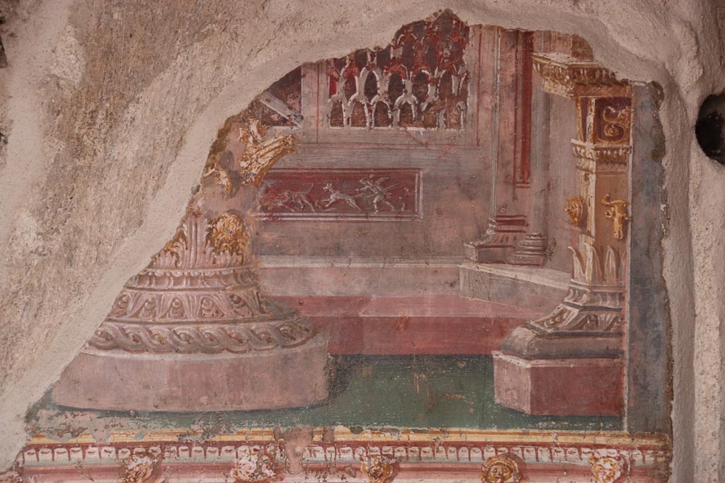 VI.15.1 Pompeii. October 2023. 
East wall of atrium, detail of painted decoration from panel between cubiculum (d) and into oecus (e). Photo courtesy of Klaus Heese.
