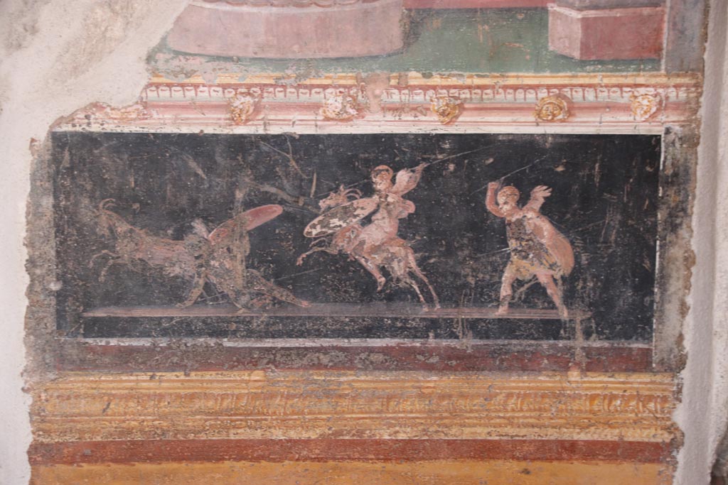VI.15.1 Pompeii. October 2023. 
East wall of atrium, detail of painted decoration from panel between cubiculum (d) and oecus (e). Photo courtesy of Klaus Heese.
