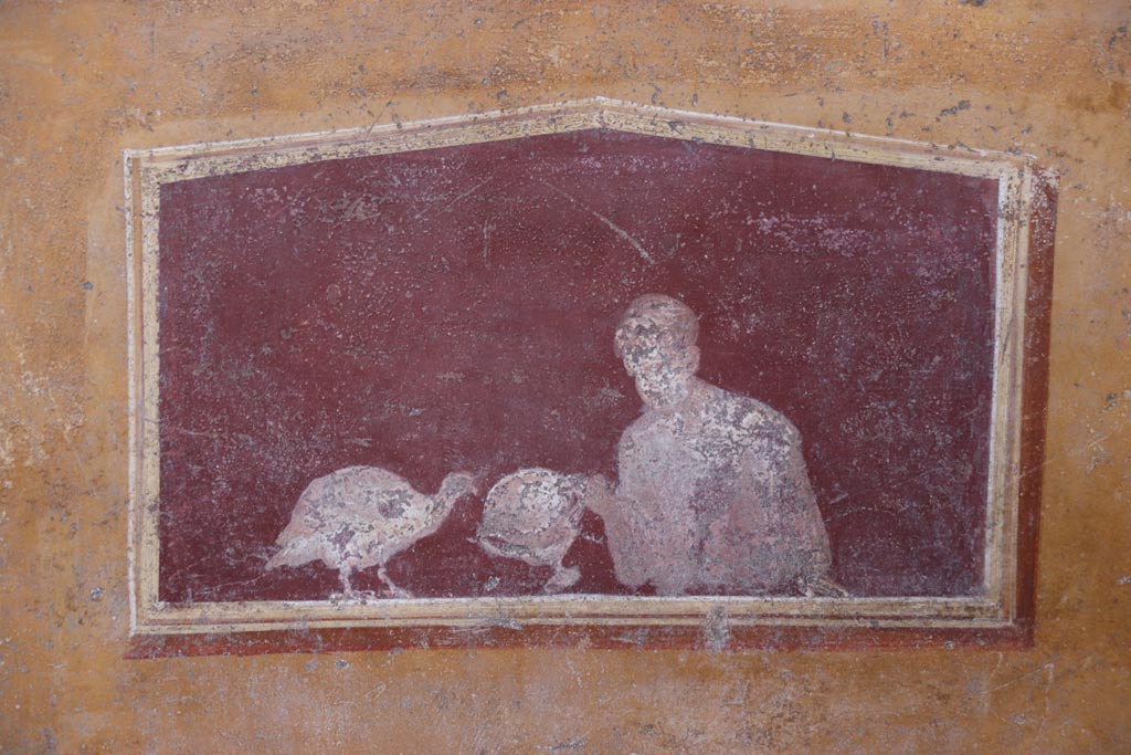 VI.15.1 Pompeii. October 2023. 
East wall of atrium, detail of lower painted panel between cubiculum (d) and oecus (e). Photo courtesy of Klaus Heese.
