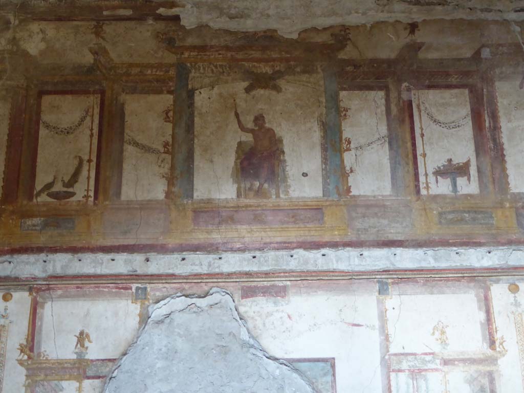 VI.15.1 Pompeii. May 2017. Painting of Zeus on his throne with sceptre and lightning bolt on upper centre of west wall. Photo courtesy of Buzz Ferebee.
