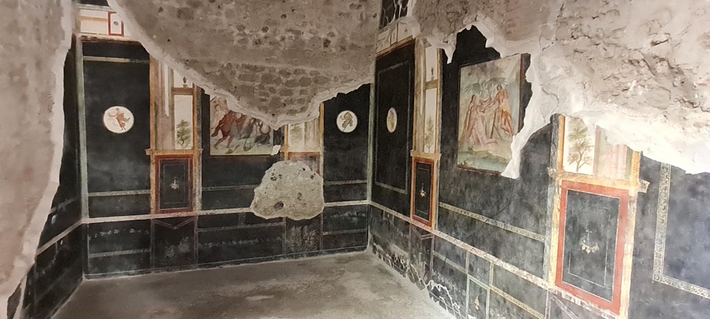 VI.15.1 Pompeii. April 2023. 
Looking towards east wall, south-east corner and south wall of black triclinium “t”. Photo courtesy of Giuseppe Ciaramella.

