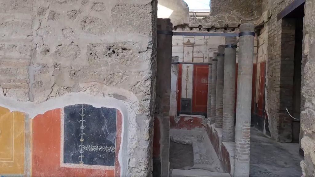 VI.15.1 Pompeii. April 2023. 
Looking north through doorway into small courtyard "s", from north portico. Photo courtesy of Giuseppe Ciaramella.
