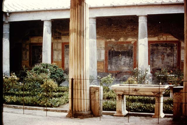 VI.15.1 Pompeii. May 1923 photograph. Looking west across peristyle from east portico.
Photo courtesy of Rick Bauer.
