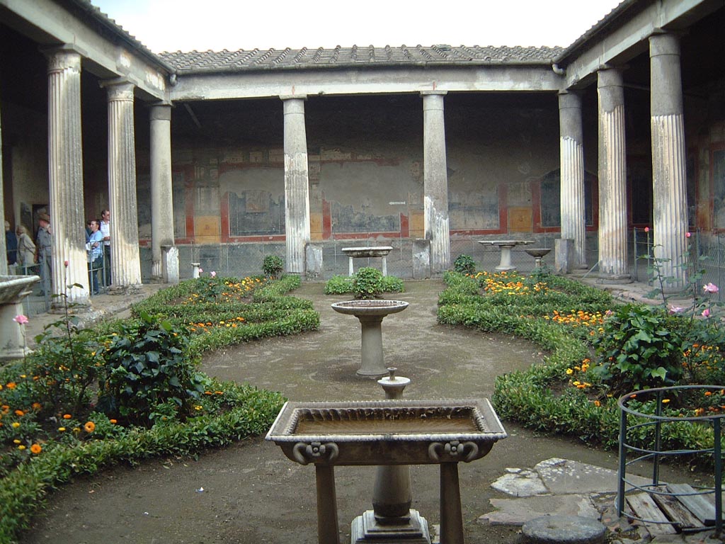 VI.15.1 Pompeii. 1960’s. Looking towards the south wall at the east end of the south portico of the peristyle. 
Photo courtesy of Rick Bauer.
