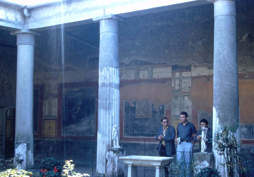 VI.15.1 Pompeii. 1960’s. Looking towards the south wall at the east end of the south portico of the peristyle. 
Photo courtesy of Rick Bauer.
