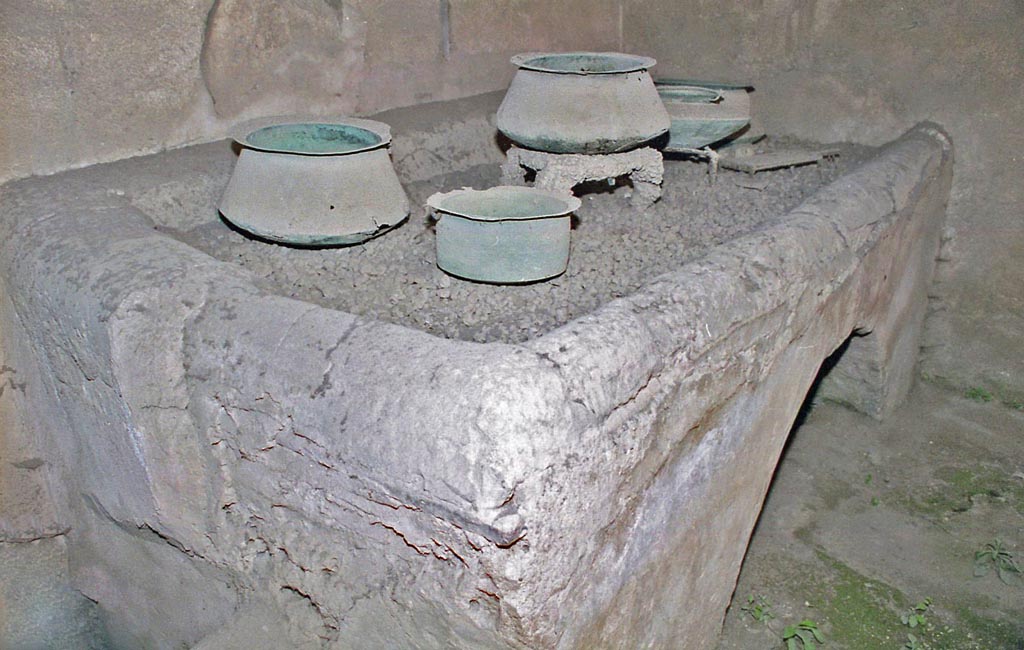 VI.15.1 Pompeii. October 2001. Kitchen hearth in service area. Photo courtesy of Peter Woods.