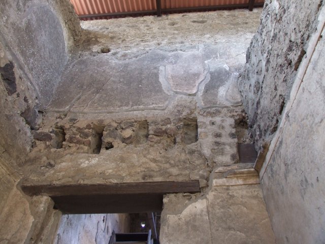 VI.15.9 Pompeii. March 2009. Kitchen area, doorway through to kitchen and latrine. Looking west.