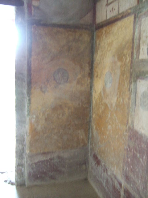 VI.16.7 Pompeii. May 2006. Room F, north portico. Looking east at doorways to rooms M, L, K, and J.