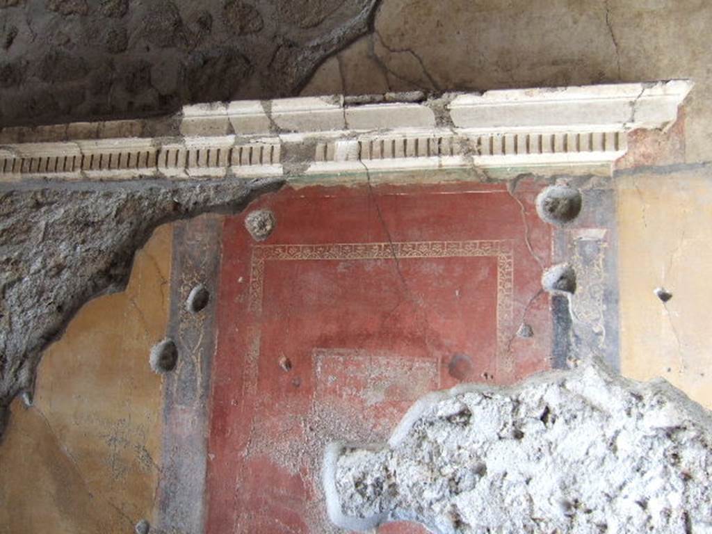 VI.16.7 Pompeii. May 2006. Room C, south wall with First style denticulated cornice.