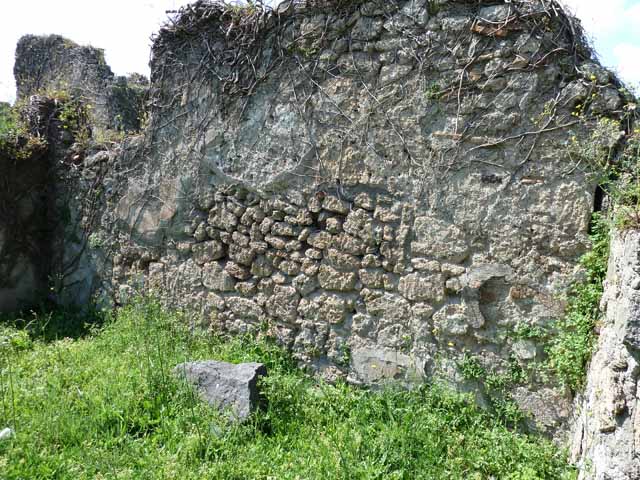 VI.16.11 Pompeii. December 2004. Looking west to room in north-west corner of shop and corridor to rear in south-west corner.