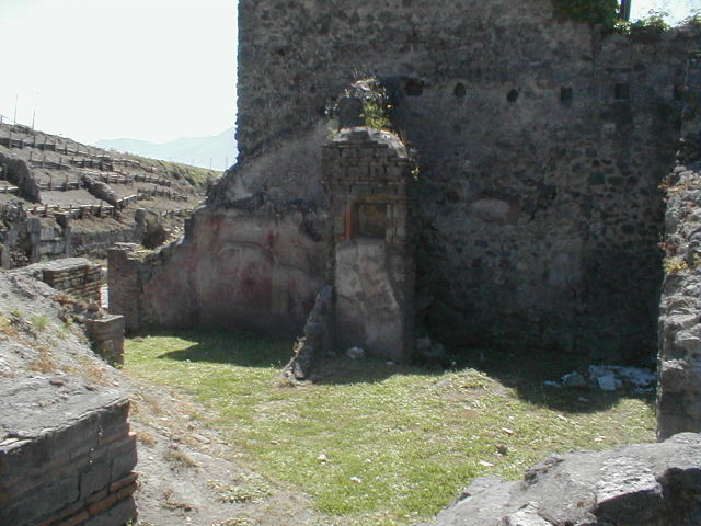 VI.16.20 Pompeii. March 2009. Niche in south wall, originally this may have been in a rear room of VI.16.21/22. According to Boyce, numbered VI.16.20-24. In the central room on the south side of the house is a rectangular niche. It is in the north side of a pilaster which projects from the east wall (now collapsed). On the wall below the niche, were painted two large yellow serpents on a red background. Not. Scavi, 1908, 182.
See Boyce G. K., 1937. Corpus of the Lararia of Pompeii. Rome: MAAR 14. (p.59, no.225)