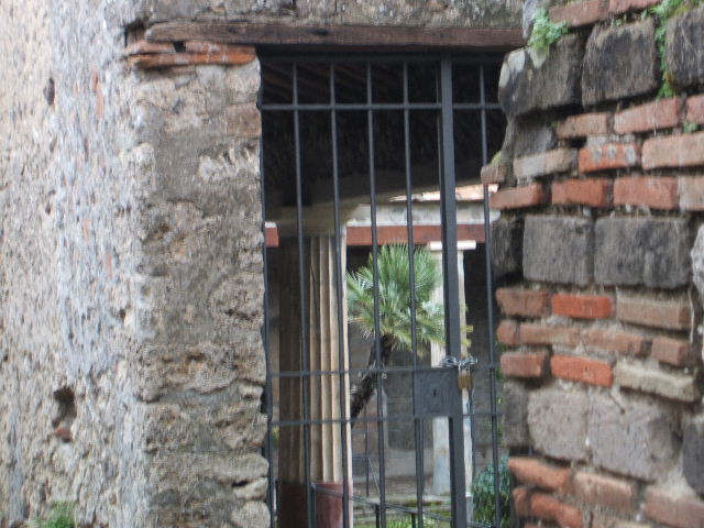 VI.16.38 Pompeii. May 2010. Looking west from doorway towards dormitory or store-room and corridor to rear entrance at VI.16.38