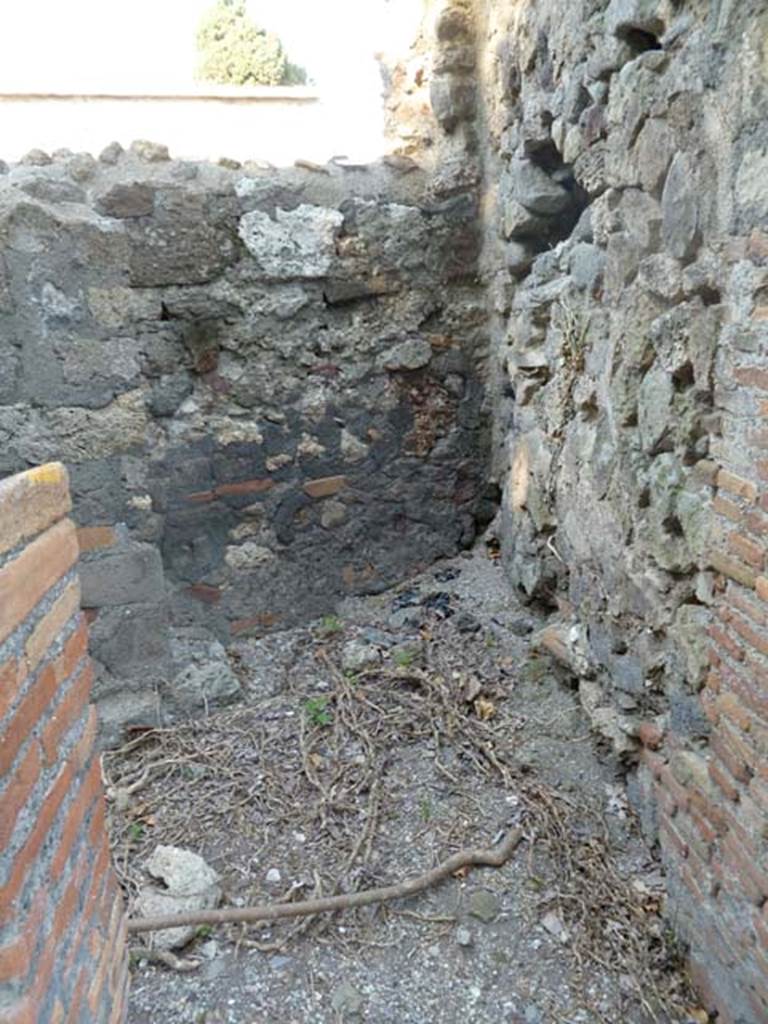 VI.17.1 Pompeii. May 2011. Looking east into small room, latrine or corridor on north side of hearth.