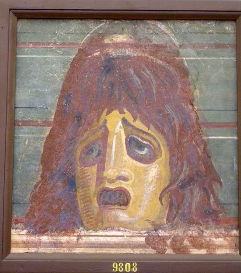 VI.17.9-10 Pompeii. Found 20-29 October 1763. 
Mask, the best and most perfect example, with a green background.
Now in Naples Archaeological Museum. Inventory number 9808.
According to Pagano and Prisciandaro, this mask was found 2nd July 1763 (found also with inv. nos. 9854 and 9853 below) and so we have also included it in HGW04, from where they say it was found.
See Pagano, M. and Prisciandaro, R., 2006. Studio sulle provenienze degli oggetti rinvenuti negli scavi borbonici del regno di Napoli.  Naples: Nicola Longobardi. (p.44) (PAH 1, addendum 113, n.9)
