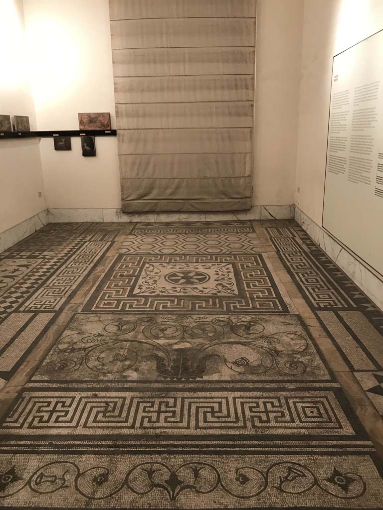 VI.17.9-10 Pompeii. April 2019. Mosaic in centre of photo is that “from room 3”. 
Floor re-laid in room of Naples Archaeological Museum.
Photo courtesy of Rick Bauer.
