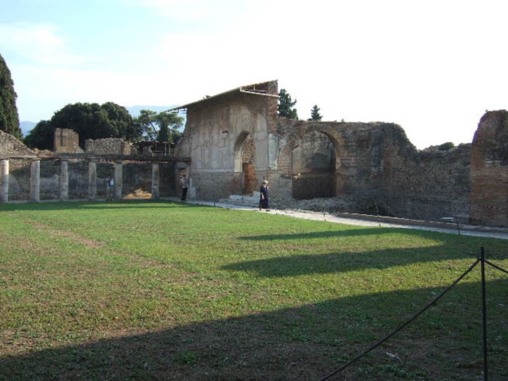 VII.1.8 Pompeii. September 2005. 
Looking across gymnasium C towards south side of portico B and west side of baths, from north-east corner.
