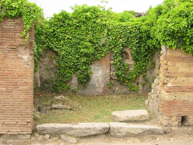 VII.2.12 Pompeii.  Shop.  December 2007.  Terracotta waste pipe from upper floor.
