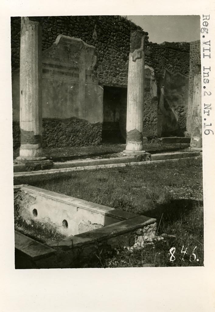 VII.2.16 Pompeii. Pre-1937-39. 
Looking north-west across pool in peristyle towards lararium niche in west wall.
Photo courtesy of American Academy in Rome, Photographic Archive. Warsher collection no. 848.
