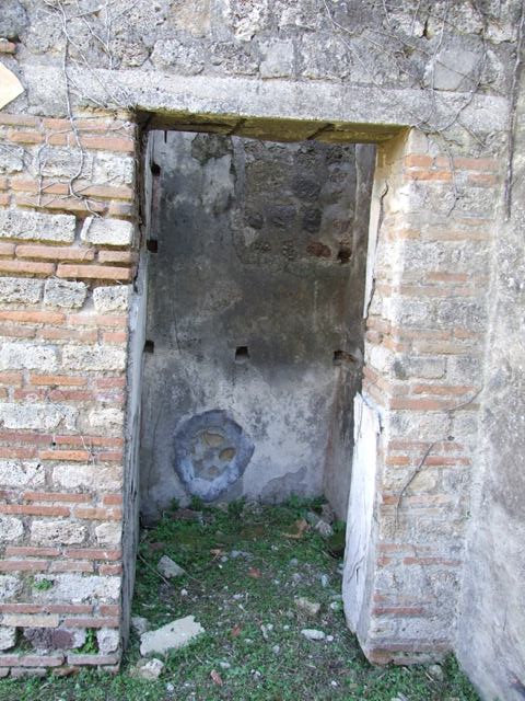 VII.2.18 Pompeii. March 2009. Doorways to room 14 and 15, cupboards.