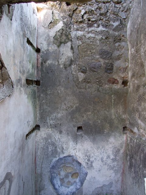 VII.2.18 Pompeii. March 2009. Room 14, east wall, with holes for remains of arched ceiling supports.