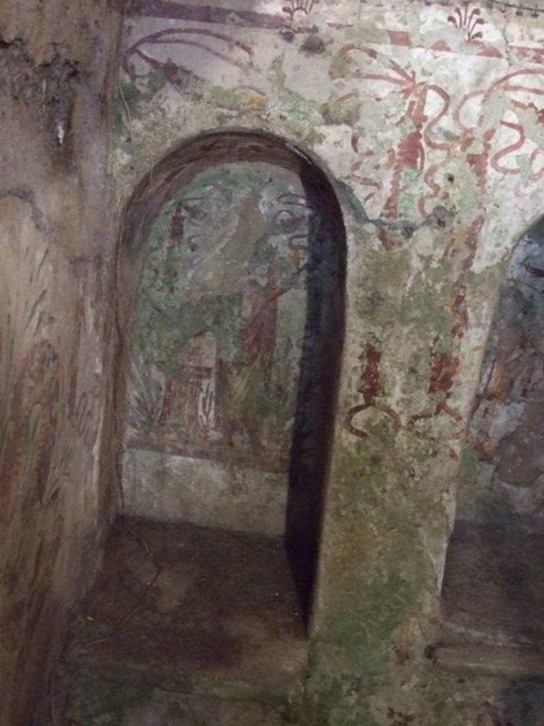 VII.2.20 Pompeii. December 2007. Sacellum, niche to the left. Boyce said that on the back wall of this niche was the Genius, togate and with a laurel wreath. With his right hand he pours a libation over the flaming altar.
See Boyce G. K., 1937. Corpus of the Lararia of Pompeii. Rome: MAAR 14. (p.62, no.253, pl.41,2) 
