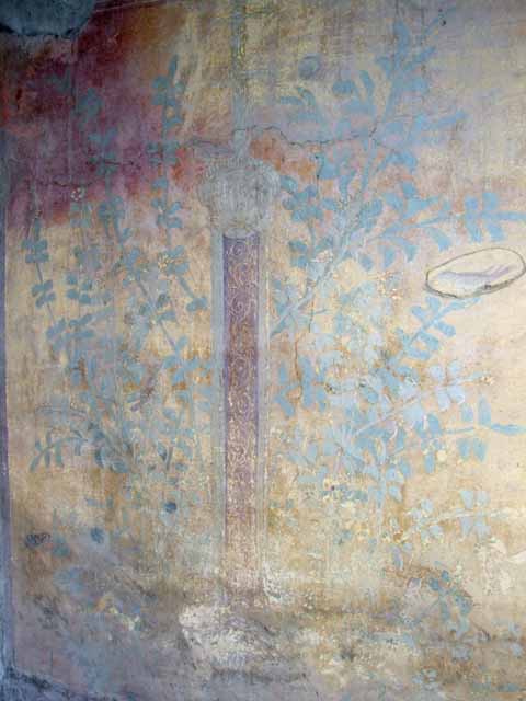 VII.2.25 Pompeii. March 2009. Viridarium. East wall with niche at north end. According to Boyce, the inside walls of the niche were painted green and blue and the ceiling was a shell of stucco. The wall around the niche was painted with a garden decoration of plants, flowers and birds. See Boyce G. K., 1937. Corpus of the Lararia of Pompeii. Rome: MAAR 14. (p.63, no. 254) Breton said that there were five bronze Penates discovered here, but these were not mentioned elsewhere. See Breton, Ernest. 1870. Pompeia, Guide de visite a Pompei, 3rd ed. Paris, Guerin. Breton, (p. 412) See Bragantini, de Vos, Badoni, 1986. Pitture e Pavimenti di Pompei, Parte 3. Rome: ICCD. (p.80)