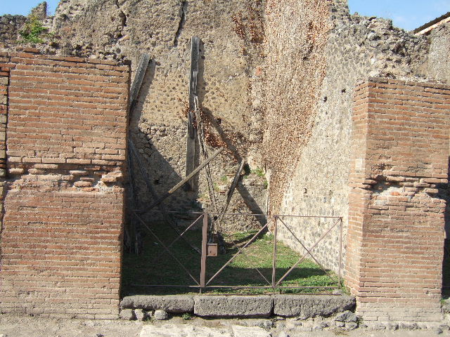 VII.2.42 Pompeii. March 2009.  West wall of shop.