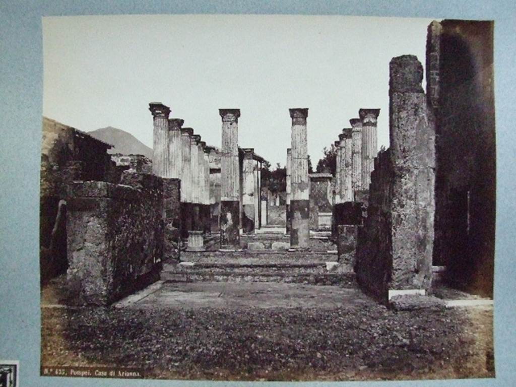 VII.4.31 Pompeii. Casa di Arianna. Tablinum and peristyle from atrium. 
Old undated photograph. Courtesy of Society of Antiquaries. Fox Collection.  The arca block is shown in this photograph, on the right hand side, at the base of the East wall. 

