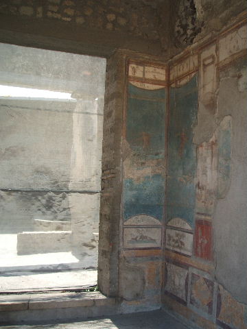 VII.4.48 Pompeii. December 2007. Room 11. Detail from West wall of Tablinum.