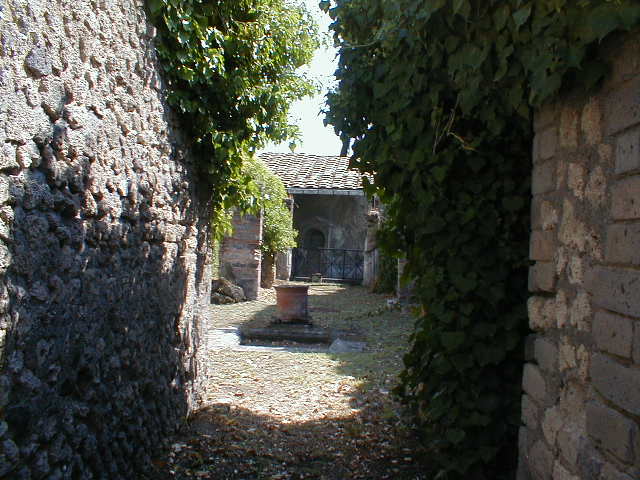 VII.4.56 Pompeii. March 2009. Room 1. Atrium. East side with Doorways to Rooms 4, 5 and 6.