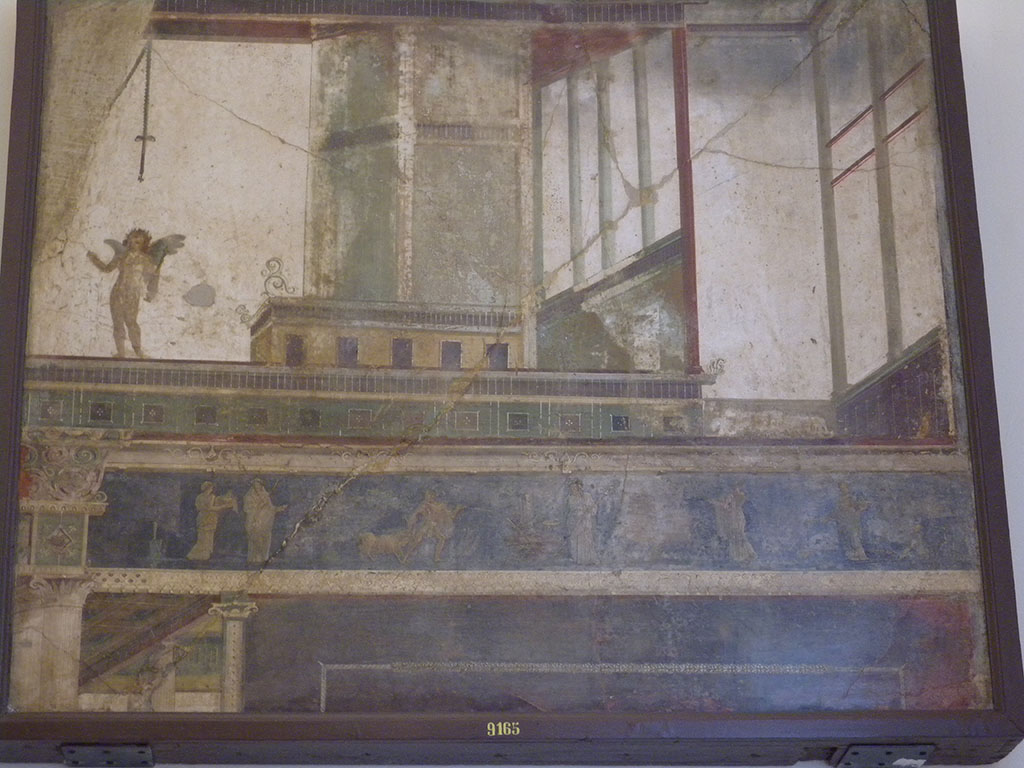 VII.6.28 Pompeii. Found on 10th April 1762. Architectural painting representing 5 doors, columns, capitals, bands and cornices of architecture; above a band is a naked cupid with a stick in the left and an object in the right; bottom scenes of sacrifice.
Now in Naples Archaeological Museum. Inventory number 9165.
See Antichit di Ercolano: Tomo Quarto: Le Pitture 4, 1765, 45-46, 221-227.
See Helbig, W., 1868. Wandgemlde der vom Vesuv verschtteten Stdte Campaniens. Leipzig: Breitkopf und Hrtel, (569).
