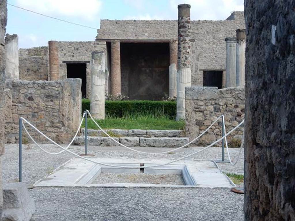 VII.7.5 Pompeii. May 2015. Looking north across marble impluvium in atrium (b). 
The floor of the atrium is a beaten mixture of small fragments of marble.
Photo courtesy of Buzz Ferebee.
