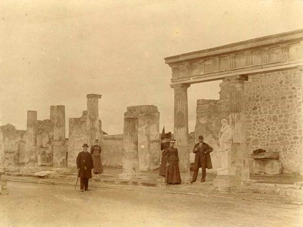 VII.7.32 Pompeii. Old undated photograph.  Looking towards the east side of Temple of Apollo. Note the statue, a marble herm of Hermes or Mercury, in front of the fifth column.
Photo courtesy of Rick Bauer.
