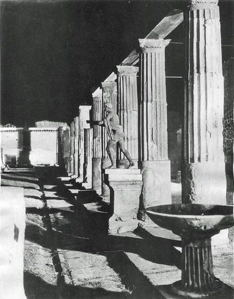 VII.7.32 Pompeii. April 1939 Looking north along the east side. Press photo entitled “Electricity comes to Pompeii”. Photo of the new 150,000 candle power lighting system under test. It was due to go into operation a week later. Photo courtesy of Rick Bauer.