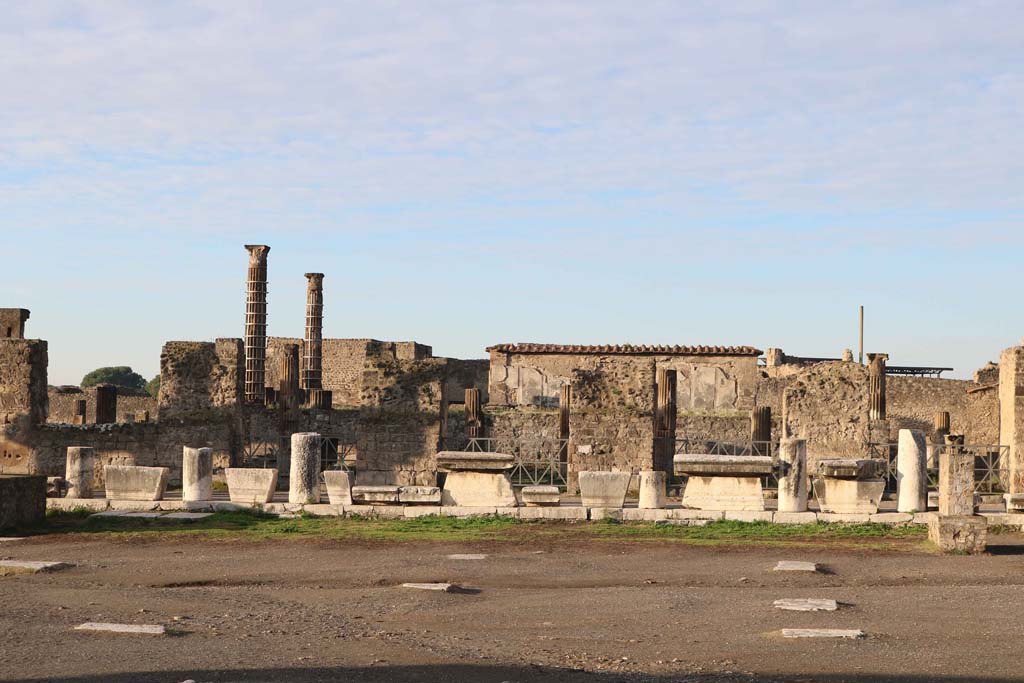 VII.7.32, from VII.8.00, The Forum, Pompeii. December 2018. 
Looking west across Forum towards Temple of Apollo, with doorway on west side, on right. Photo courtesy of Aude Durand.

