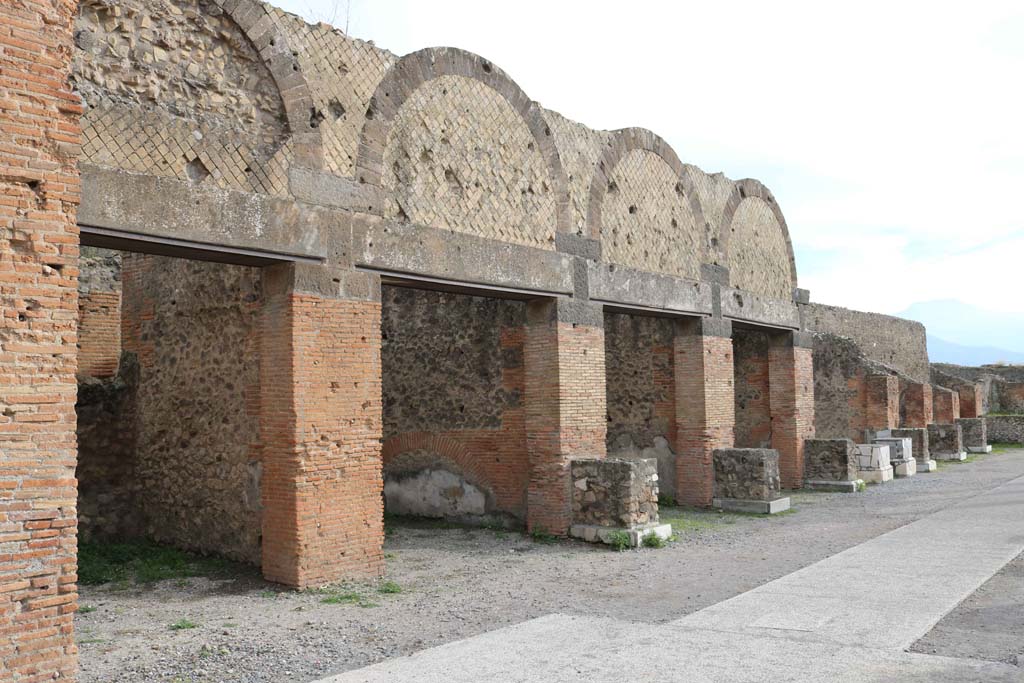 VII.8.00, Pompeii Forum. December 2108. 
Looking south along shop doorways (with VII.9.12, on left) on east side of Forum, in north-east corner. Photo courtesy of Aude Durand. 


