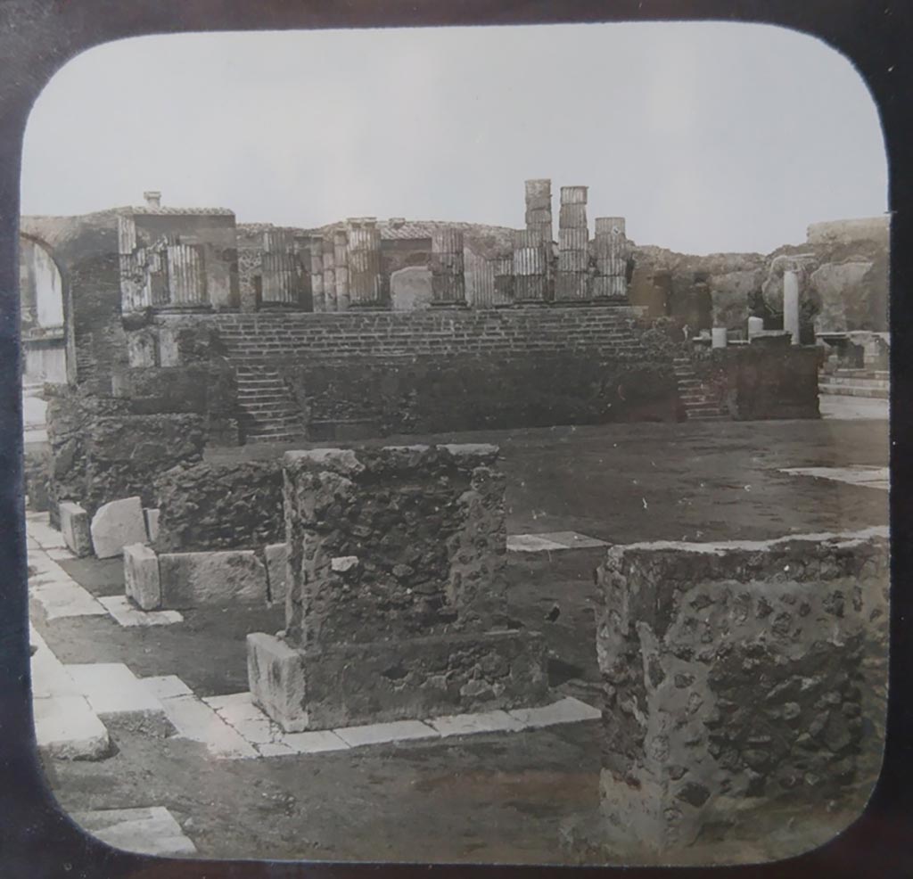 VII.8.1 Pompeii. 1944. Head of Jupiter on podium of temple. 