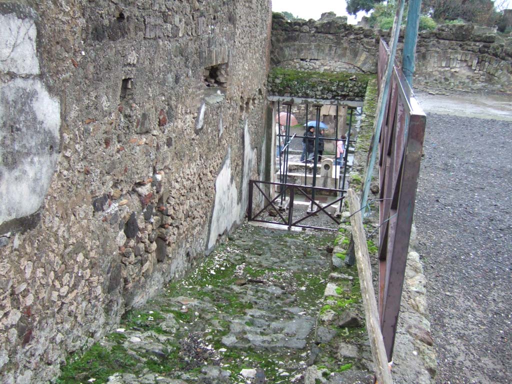 VII.9.1 Pompeii. March 2009. Passage 14. Stairs leading down to entrance at VII.9.67 on Via dell’Abbondanza.