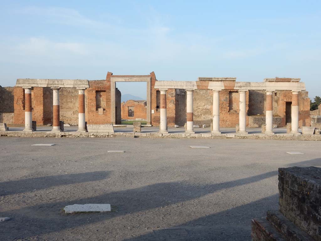 VII.9.1 Pompeii, October 2020. Looking east across Forum towards Eumachia’s portico, and entrance doorway.
Photo courtesy of Klaus Heese.
