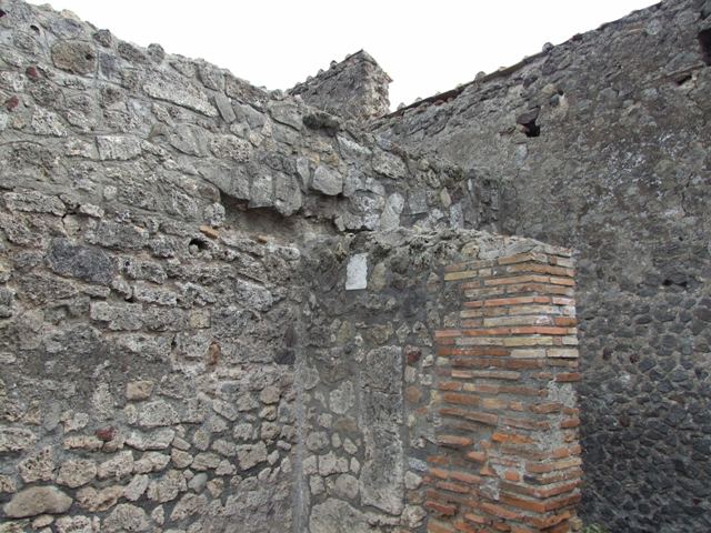 VII.9.21 Pompeii. Shop. December 2007. East wall of rear room.