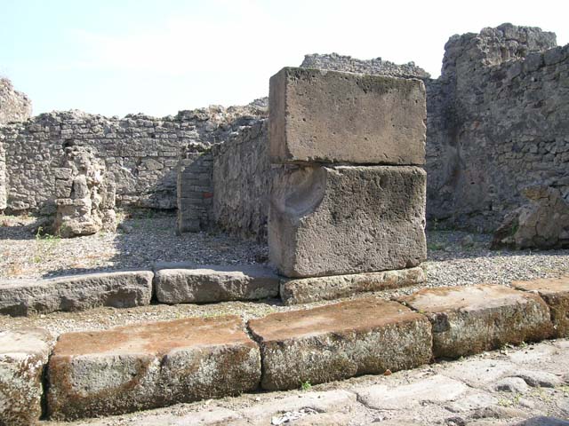VII.9.50 Pompeii. December 2005. Looking south across shop, to two rear rooms. According to Fiorelli, the shop had a counter with a simple hearth and at the rear were two rooms, one with the usual staircase. See Pappalardo, U., 2001. La Descrizione di Pompei per Giuseppe Fiorelli (1875). Napoli: Massa Editore.(p107) According to Liselotte Eschebach, to the left was a rear room with a hearth, and a downpipe from latrine on upper floor. To the right was another room with a staircase to the upper floor. See Eschebach, L., 1993. Gebäudeverzeichnis und Stadtplan der antiken Stadt Pompeji. Köln: Böhlau. (p317)