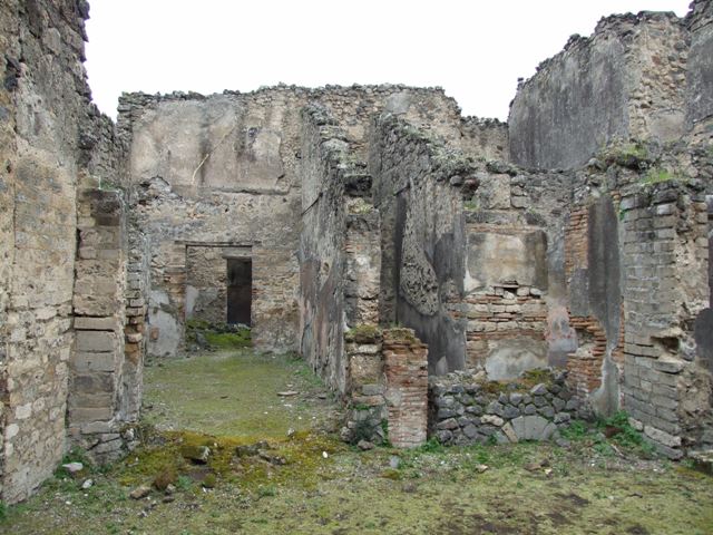 VII.11.14 Pompeii. March 2009. Garden “C”, two small niches on west wall at the north end. According to Boyce, in the same wall to the right of the lararium were set two smaller arched niches. He could not prove whether one or both of these niches had served as a shrine. He thought it was possible that they may have originally been built as lararia and then later been replaced by the large one, described above.
See Boyce G. K., 1937. Corpus of the Lararia of Pompeii. Rome: MAAR 14. (p.70, no.311)