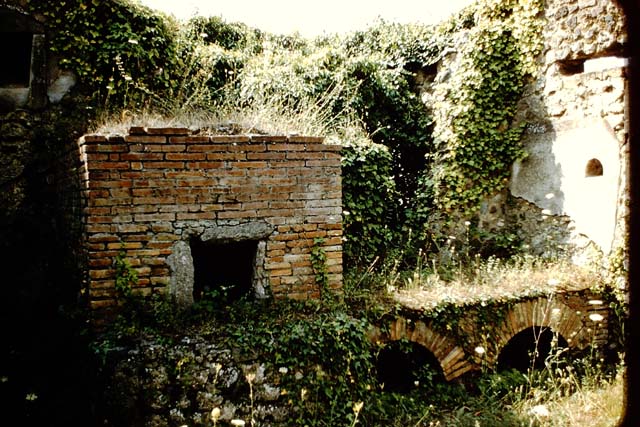 VII.14.5 Pompeii. March 2009. Room 18. West wall above Hearth or Bench.
