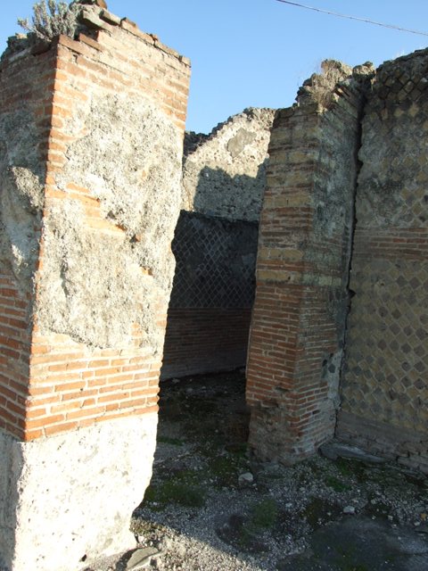 VII.16.15 Pompeii. September 2005. Doorways to rooms 12, 11, 10 and 9 on south side of atrium